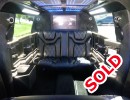 Interior of 2015 Jeep Cherokee SUV limo for sale by American Limousine Sales.