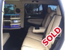 Interior of 2015 Jeep Cherokee SUV limo for sale by American Limousine Sales.